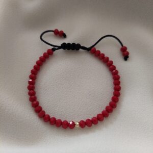 Brățară cu cristale roșii fațetate și o biluță din Aur 14K